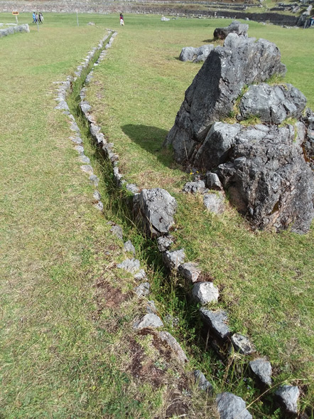 Drainage into the center of the complex.