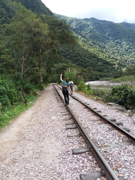 Emily walking on the train tracks.