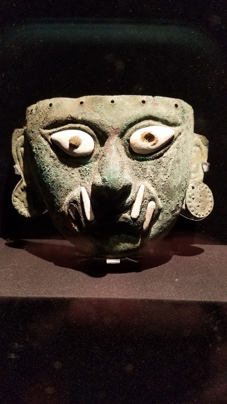 A Mochican copper burial mask.