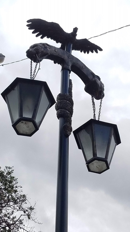 Ollantaytambo's light posts are decorated with a puma heads, a condor and a snake.