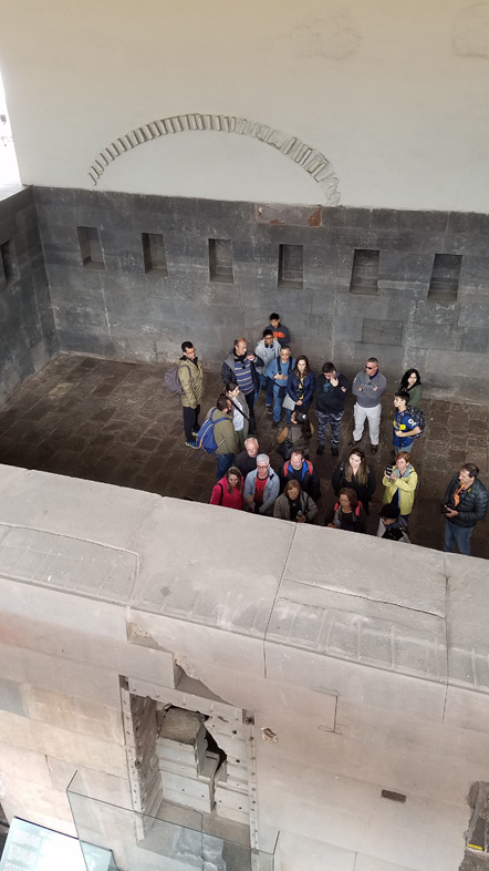 Looking into the Temple of the Moon. You can see were they build a archway through the back of the temple and have since repaired it. They used this room as a dining hall and covered the walls with plaster for a time. You can see they didn't do a great job cleaning off the stones.